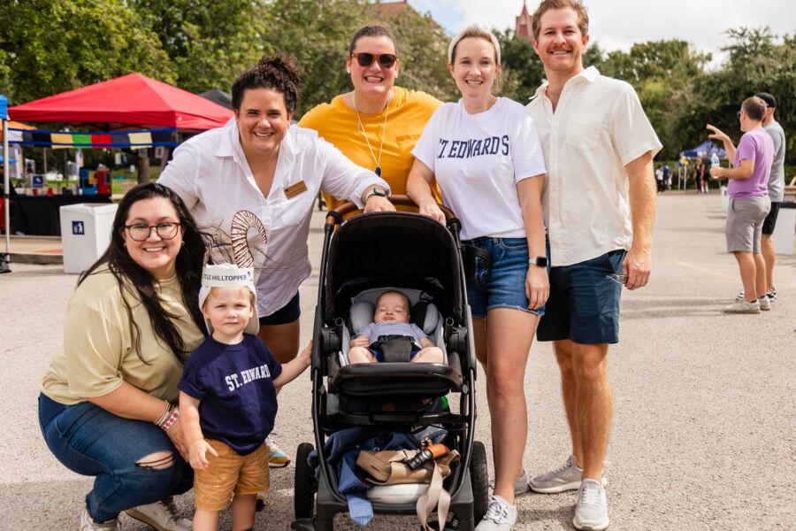 A group of staff, alumni and family at homecoming.