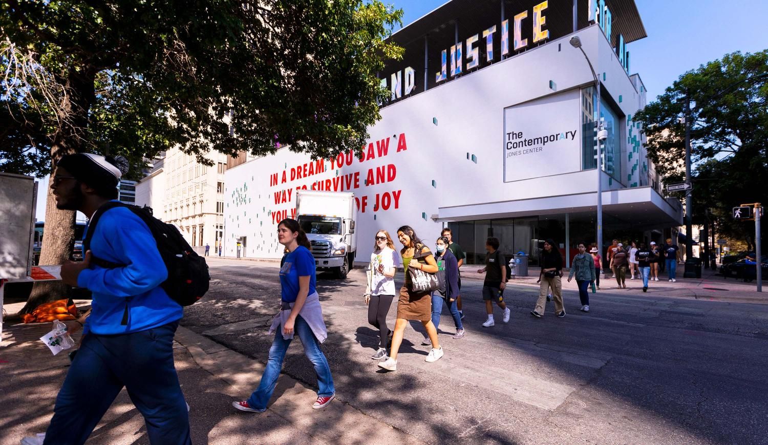 Students walking down Congress Avenue during the Black Austin Tour