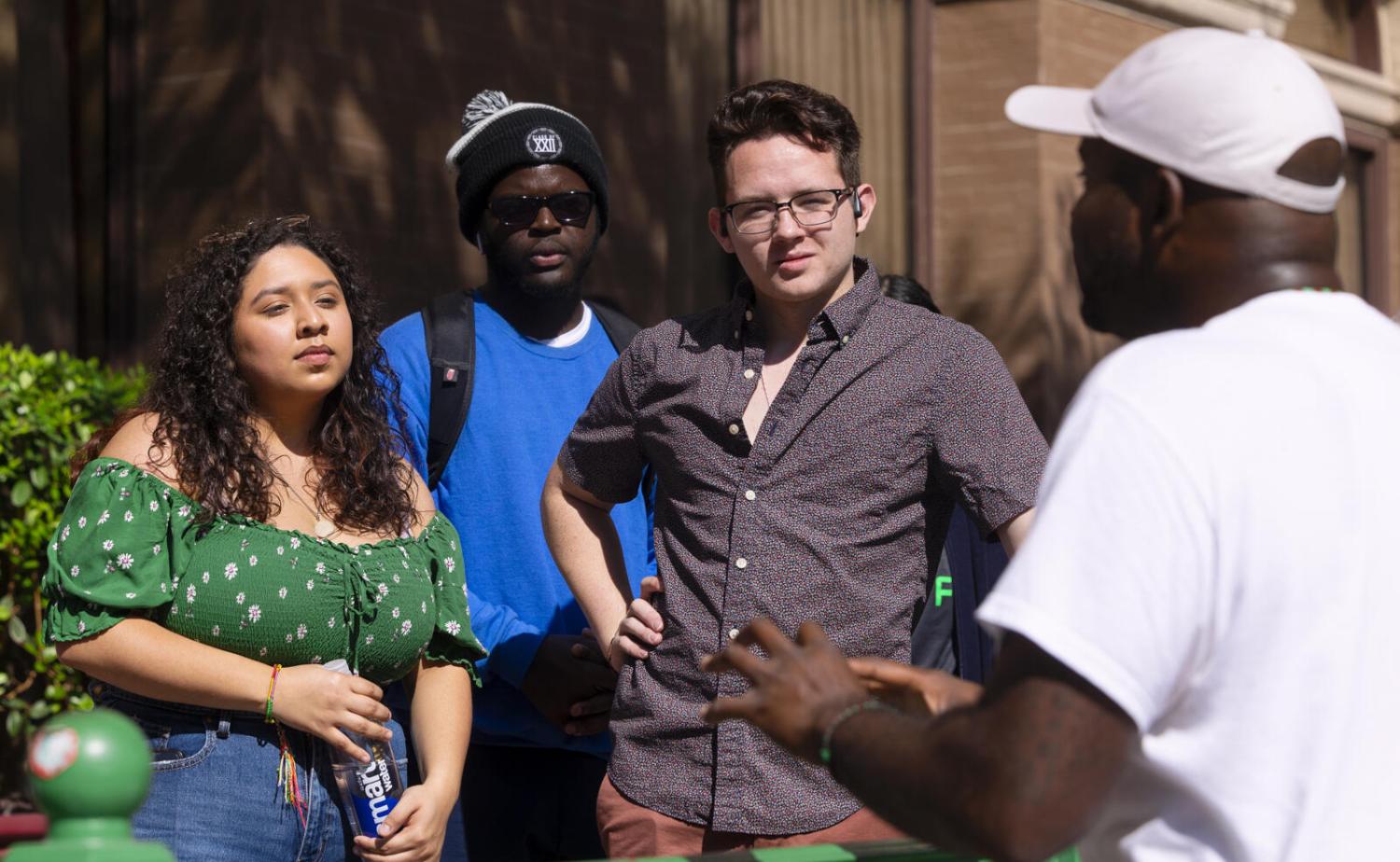 Javier Wallace speaking to students during the Black Austin Tour