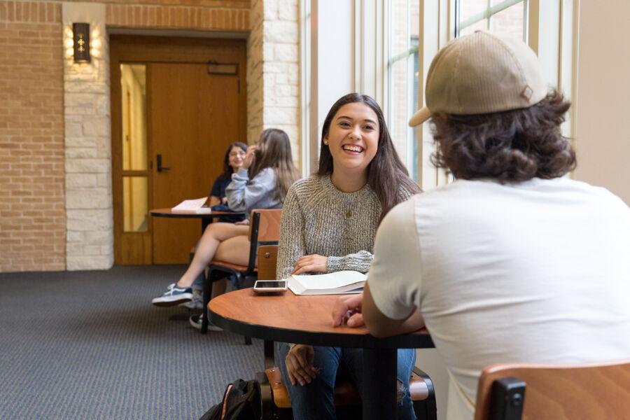 Studens sit and hang out in on-campus housing