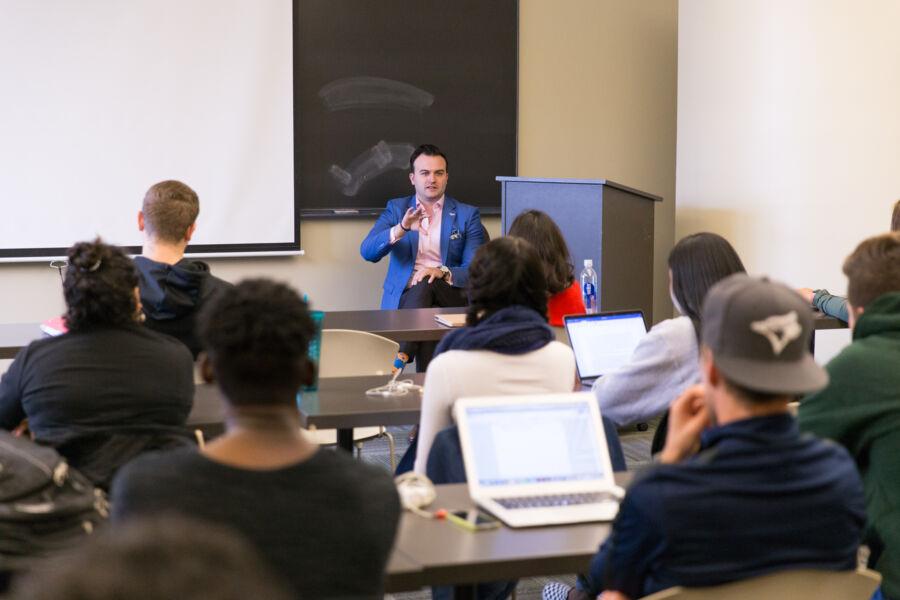 Jeff Miner speaks to a class in Trustee Hall.