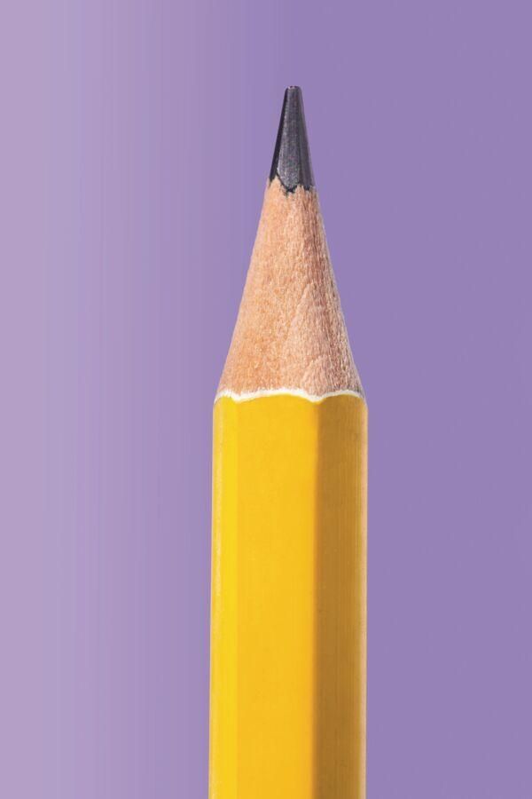 A close up of a yellow pencil on a purple background.