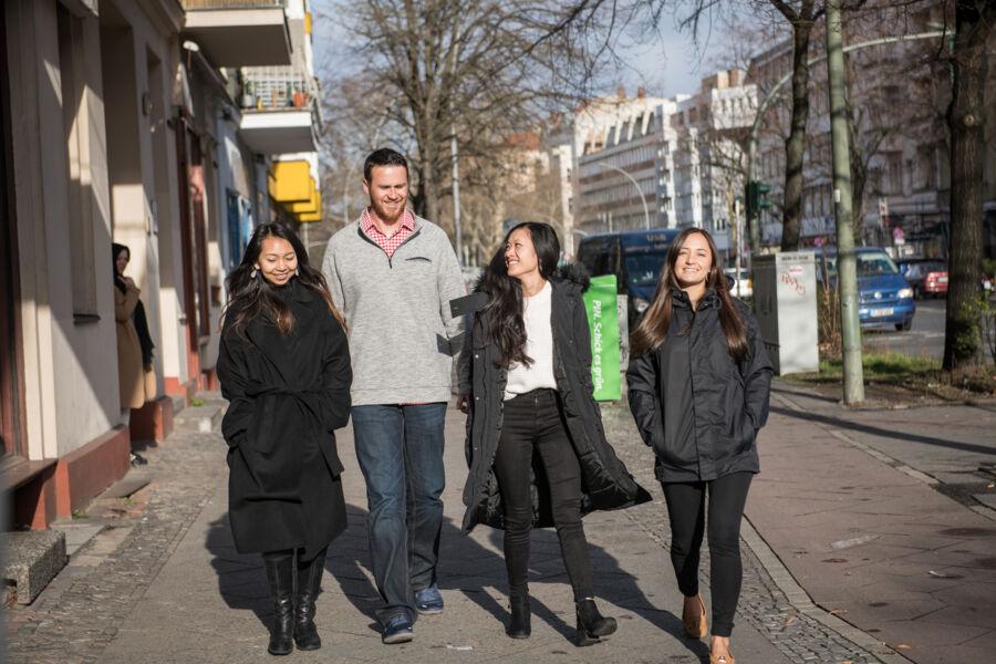 Graduate students walk together on the streets of Berlin.