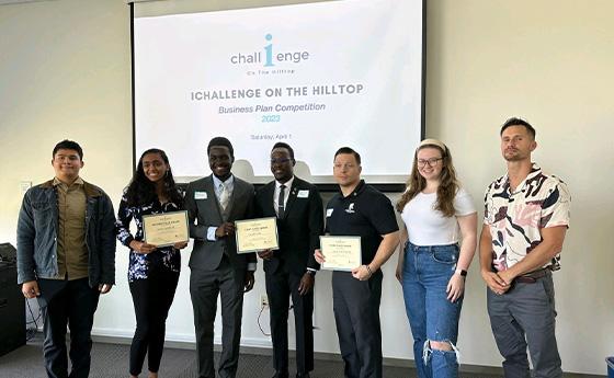 Analee Maharaj, second from left, holds a certificate and stands with six other students during iChallenge on the Hilltop.