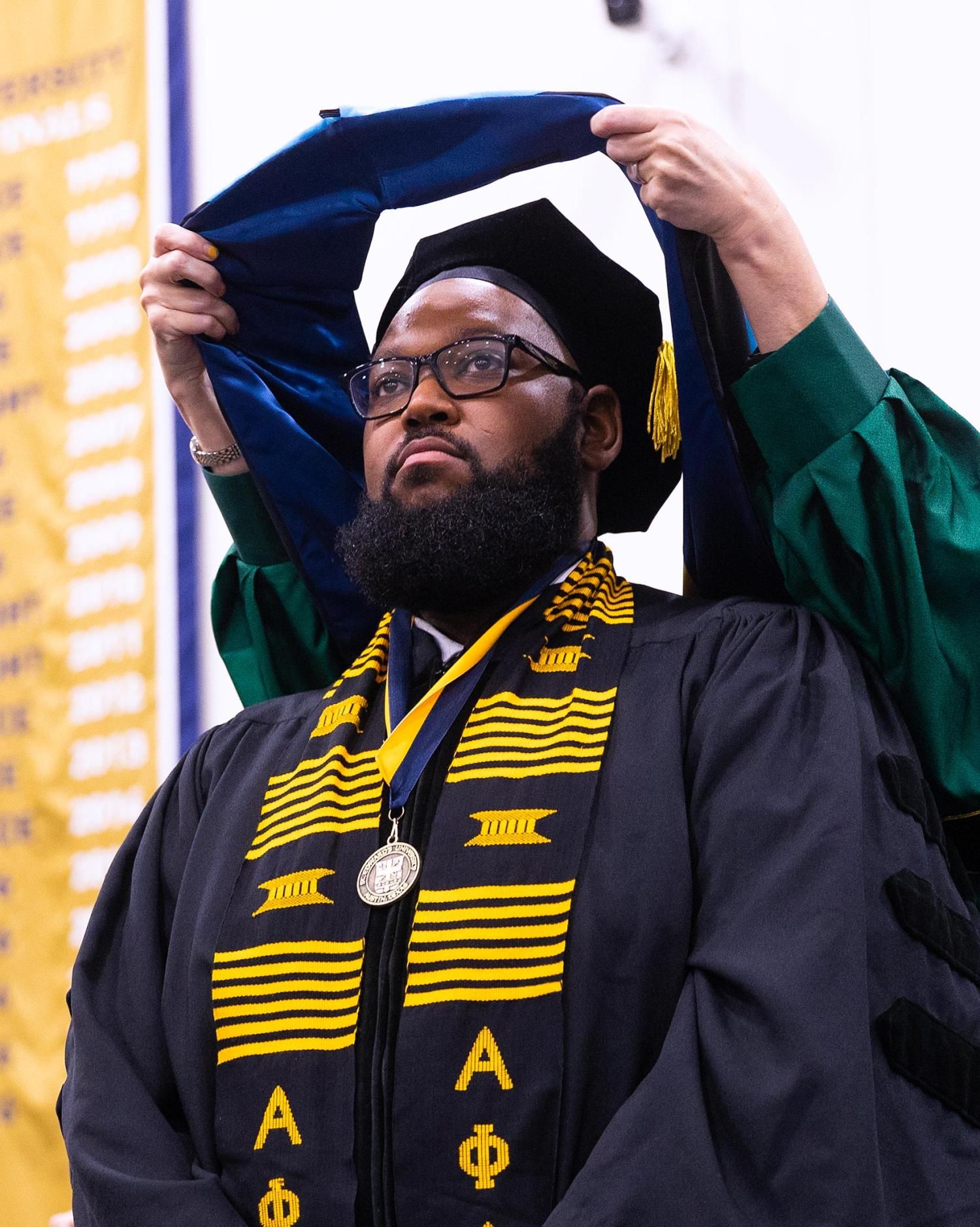 Darius Jones at doctoral hooding commencement ceremony