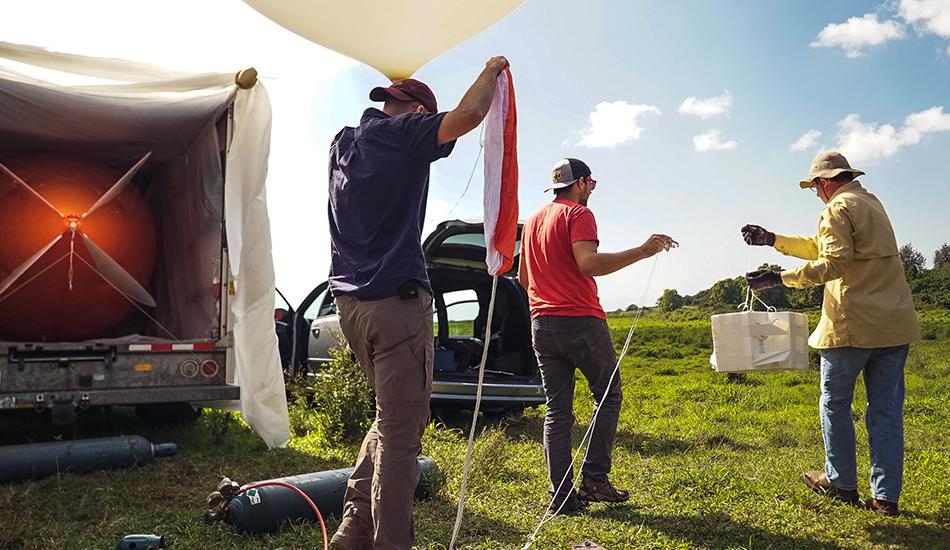 Mark Spychala, Alex Kotsakis, and James Flynn setting up experiment. 