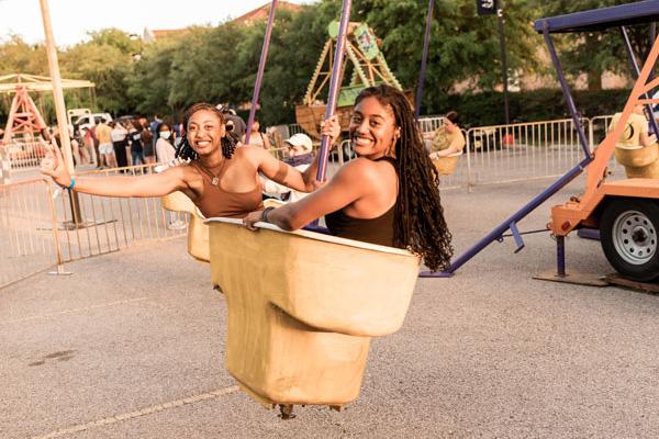 student riding carnival rides at hillfest