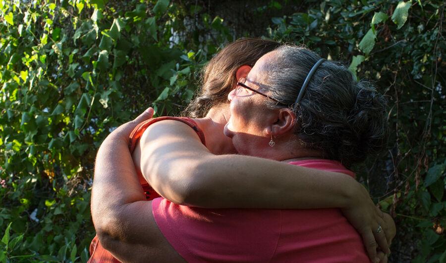 Victoria Rodriguez and her mother embrace.