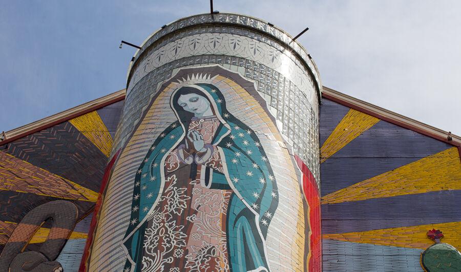 Artwork of the virgin Mary on a building.