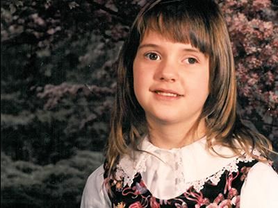 young girl with a pink floral dress on 