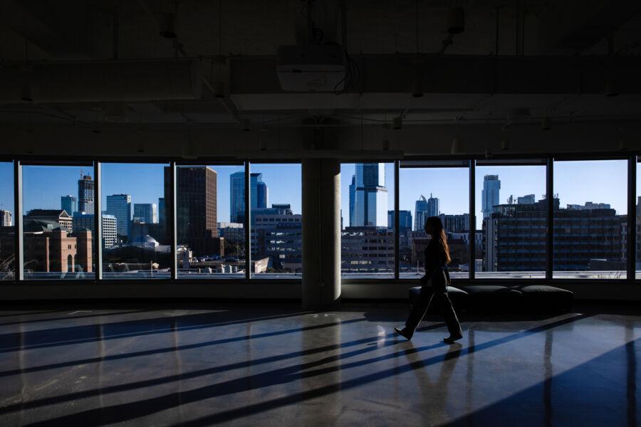Student, Cressida Rodriguez, walks across the SXSW office in downtown Austin