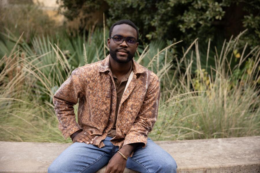 Schadrack Karekezi poses at the stairs of the Natural Sciences building